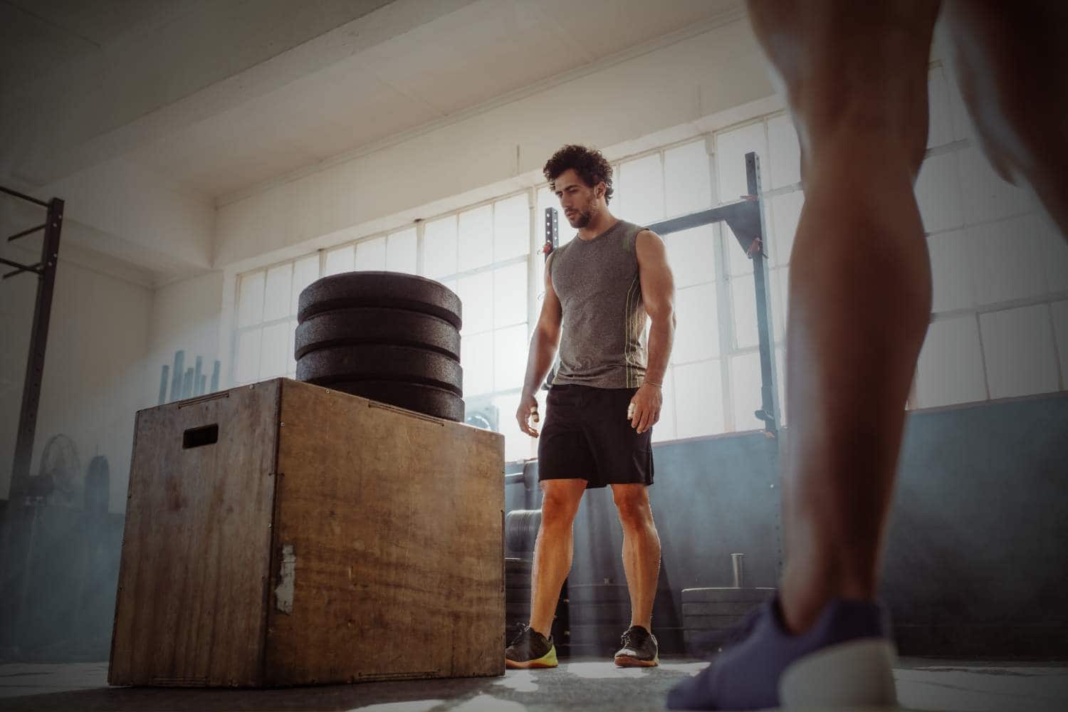 man in the gym fitness bodybuilding overthinking
