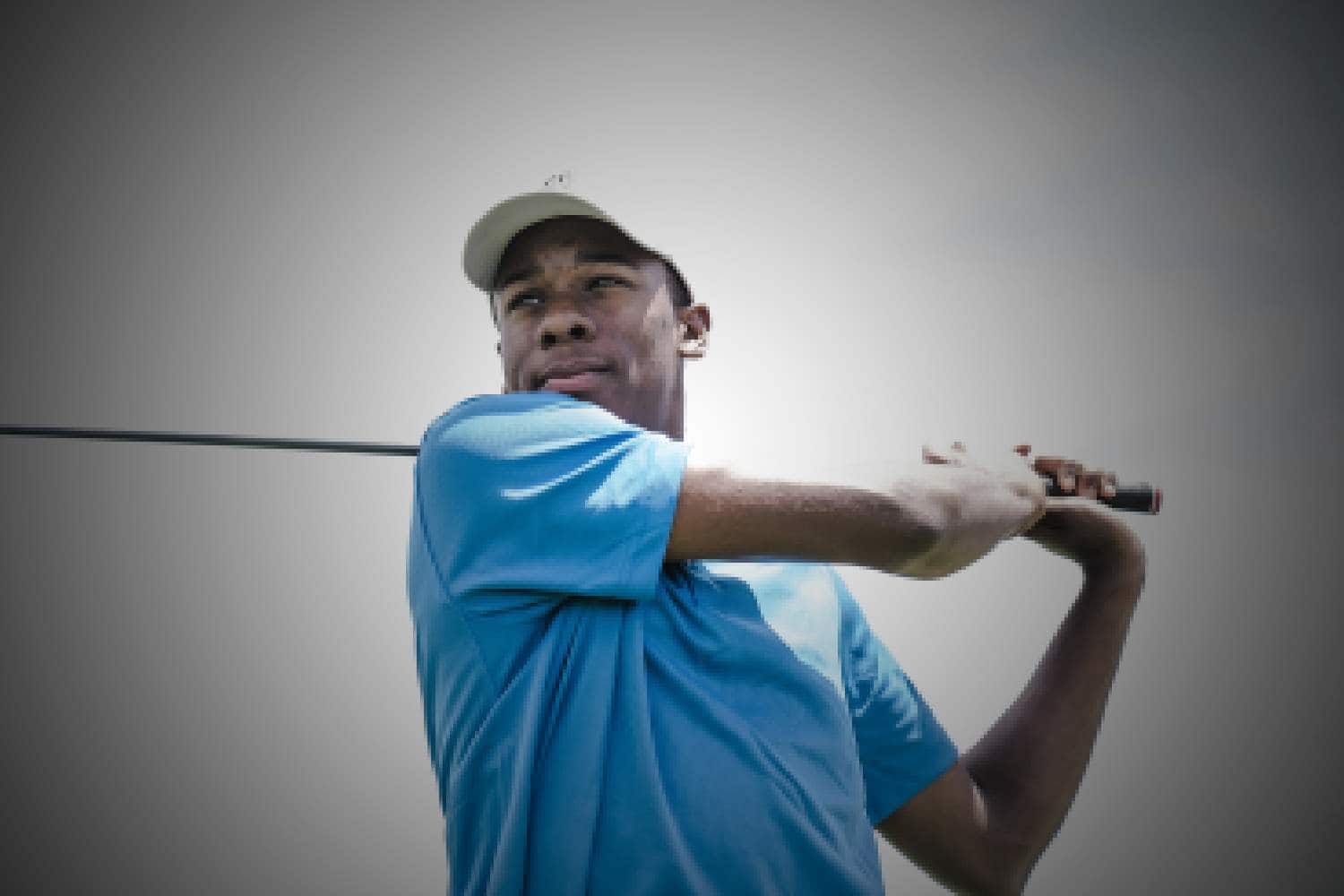man swinging golf stick